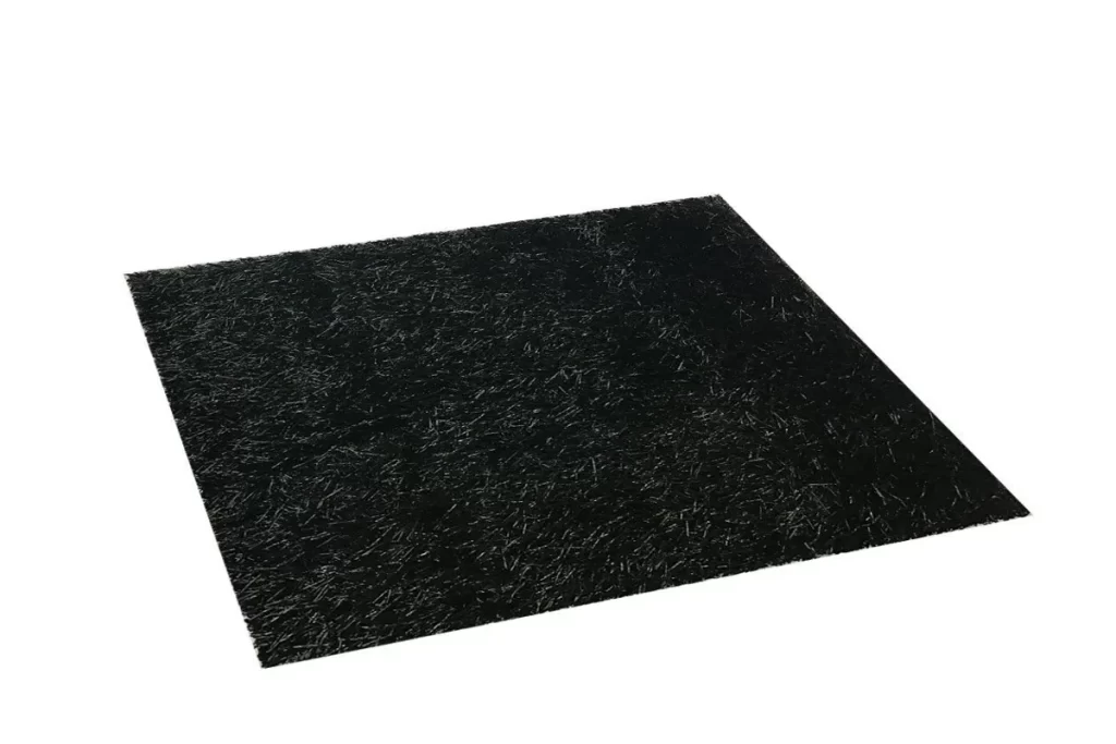 Black artificial grass carpet installed in a modern outdoor seating area in Dubai, providing a sleek and unique flooring solution