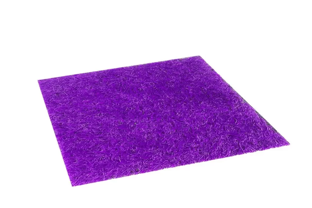 Colorful 26C140 purple artificial grass carpet laid in an outdoor area, showcasing a rich and vibrant look