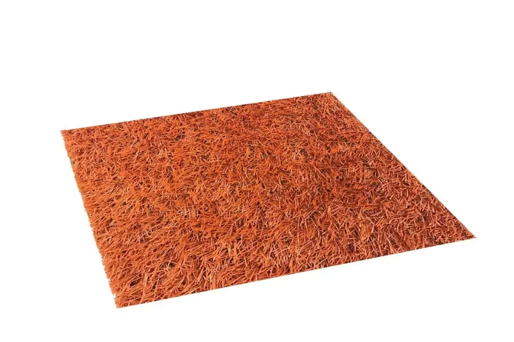 Striking 26C140 red artificial grass carpet used for a stylish event setup in Dubai, adding a vivid and luxurious touch