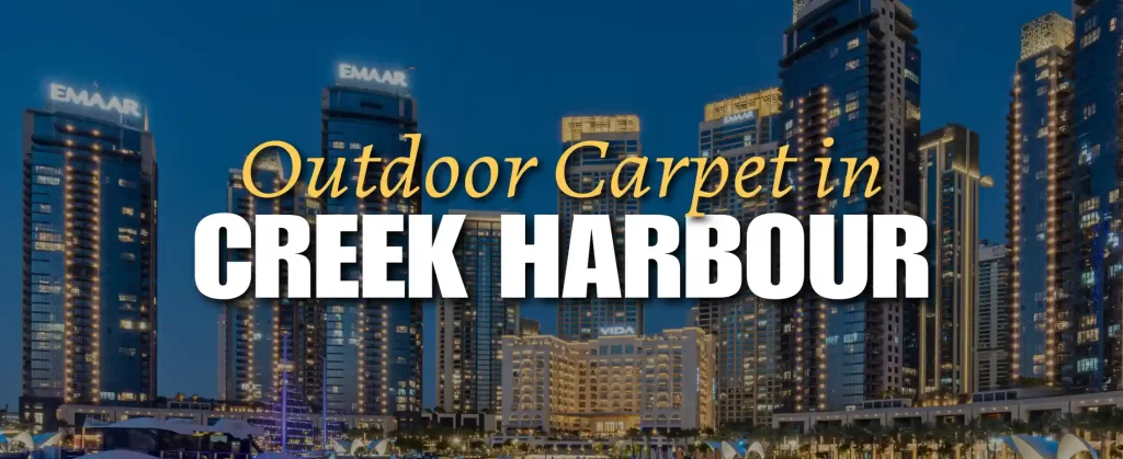 Outdoor carpet on a modern balcony in Dubai Creek Harbour, overlooking the skyline and waterfront, with sleek outdoor furniture and a panoramic view of the Creek and Burj Khalifa in the distance