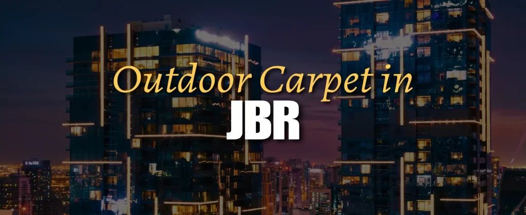 Outdoor carpet on a stylish balcony in JBR, Dubai, overlooking the beach and high-rise towers, with modern outdoor furniture and a sunny coastal backdrop