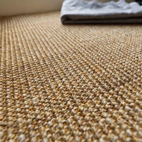 Stylish Diagonal Weave Sisal Carpet installation in a Dubai living room