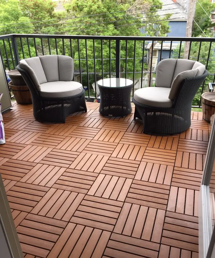 Interlocking wooden decking tiles on cozy balcony
